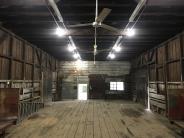 large open freight room with railroad carts